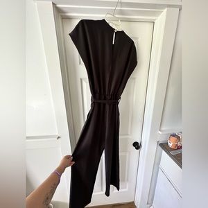 Black jumpsuit from 2Hearts. Worn once, full length with pockets.